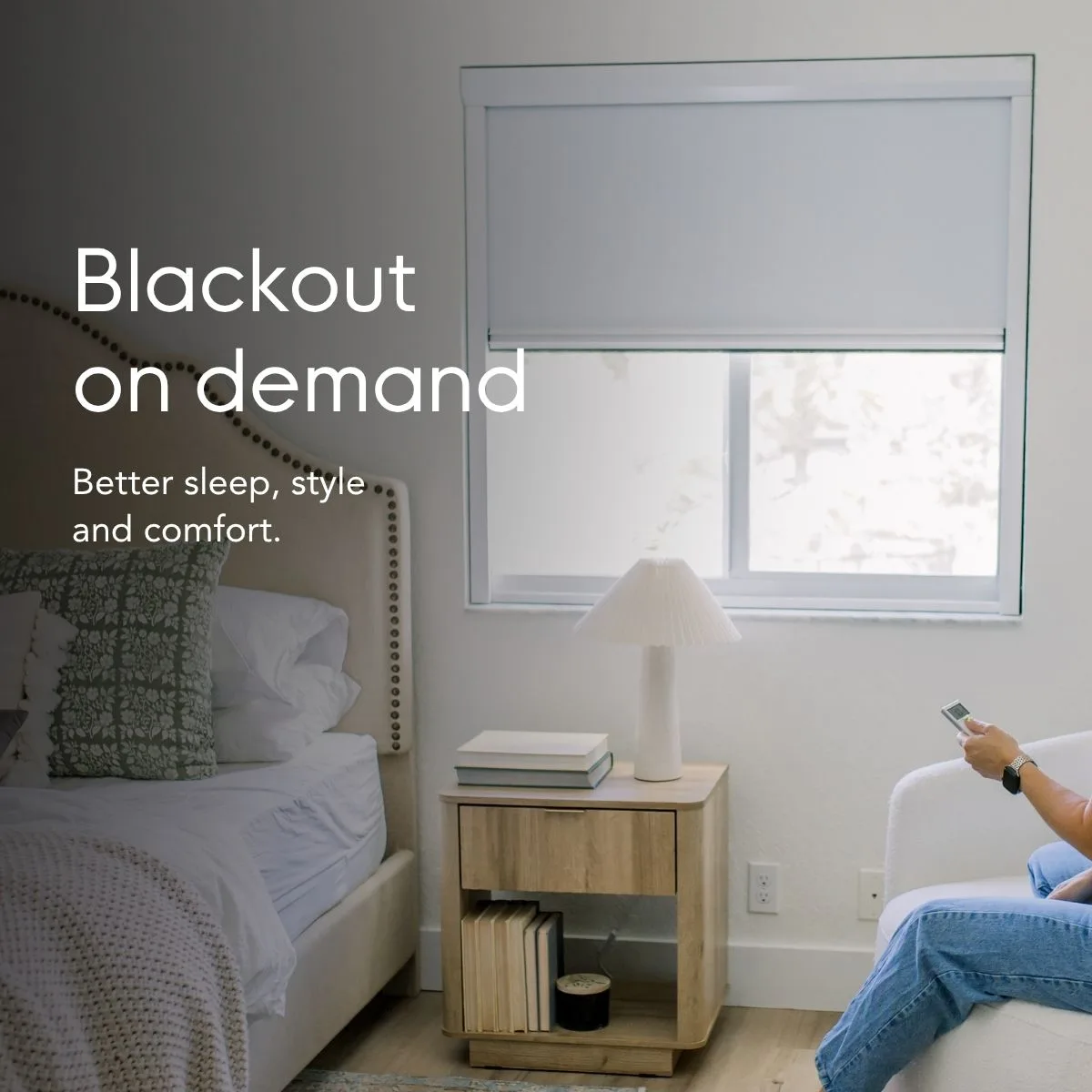 Blackout on demand — better sleep, style and comfort, shown in a bedroom with the shade lowered by remote